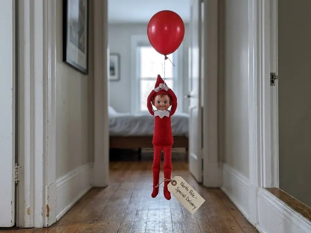Toy elf doll floating in a doorway holding a red helium balloon with a luggage tag