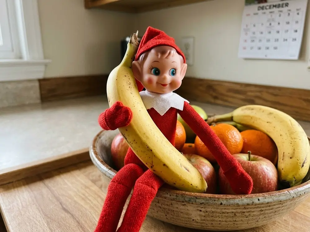 Toy elf doll holding a banana to its ear like a telephone