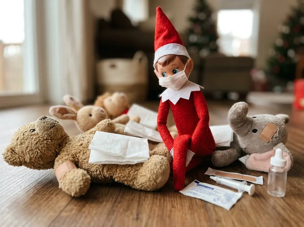 Toy elf doll plays doctor: stuffed animals lined up with band-aids on, elf wearing a tissue face mask
