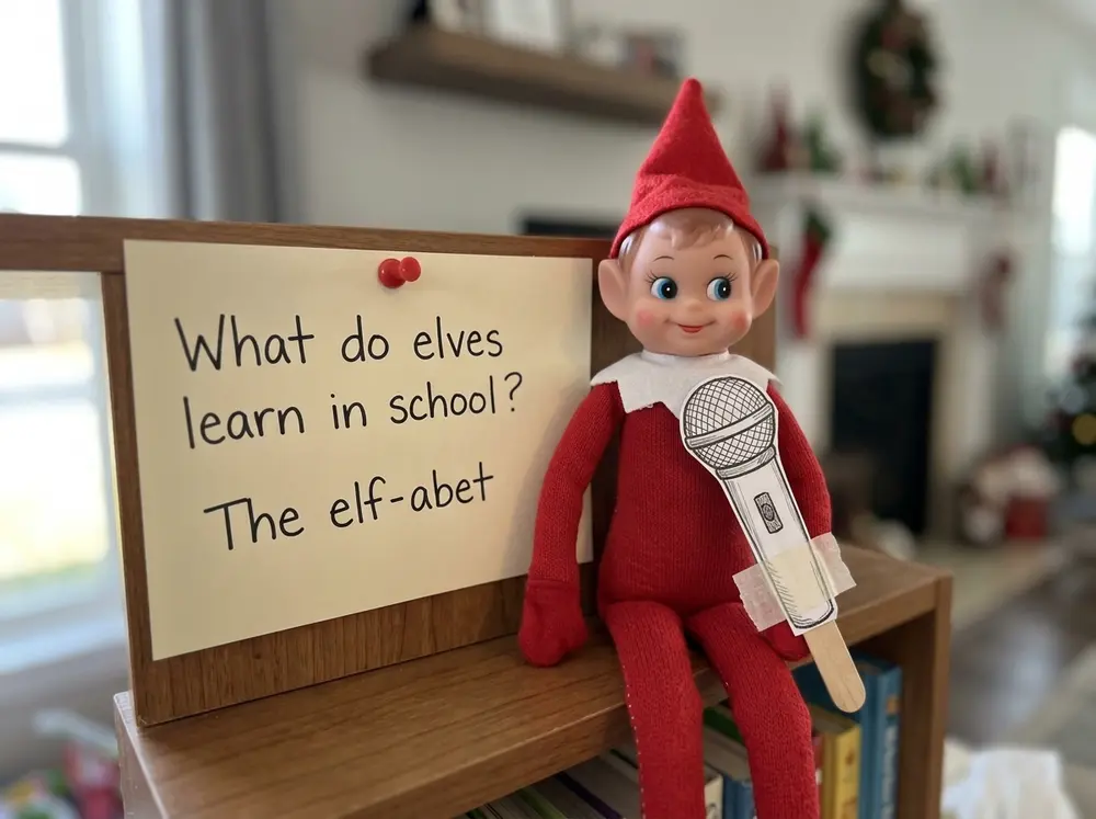 Toy elf doll pins up a Christmas joke on paper ('What do elves learn in school