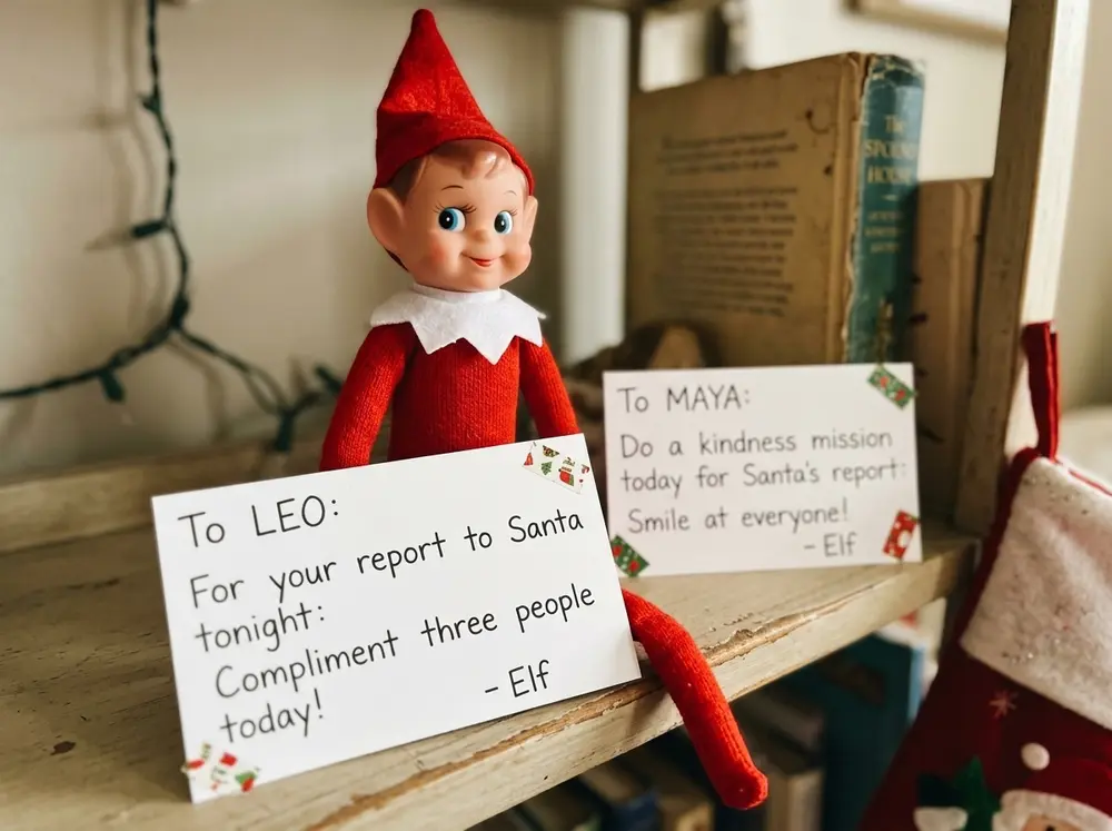 Toy elf doll leaves each child a mission card: one small kind act to do today, to be reported to Santa tonight