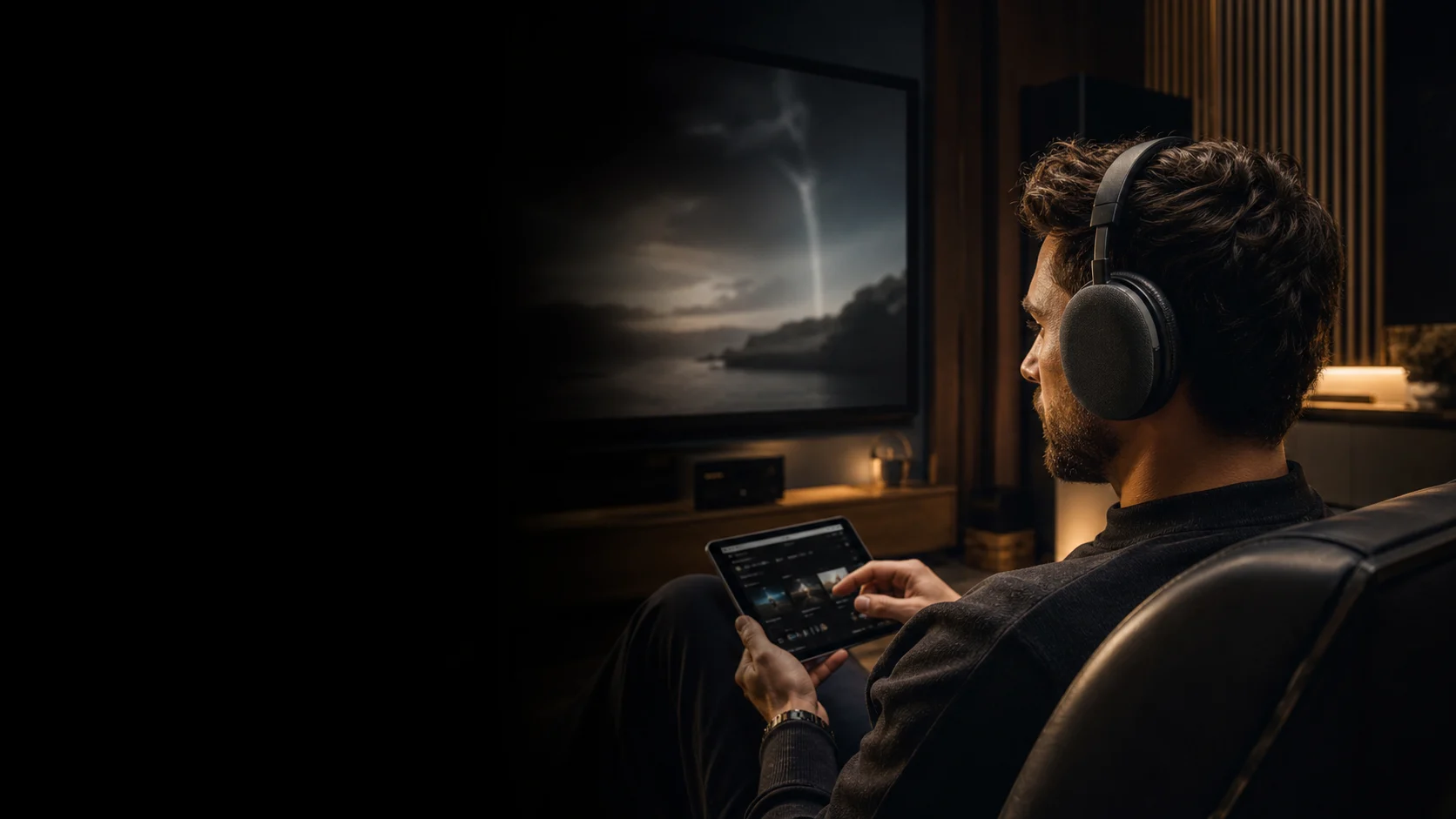 Representative listener using premium over-ear headphones in a home cinema